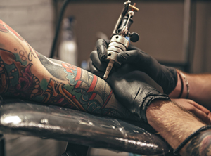 A traditional sleeve being tattooed