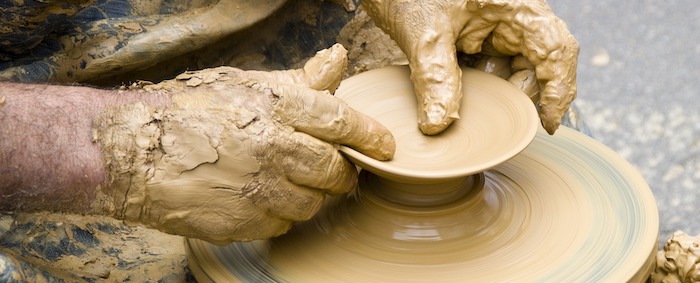 Hands doing pottery