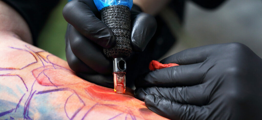 Close up photograph of a tattoo in progress.